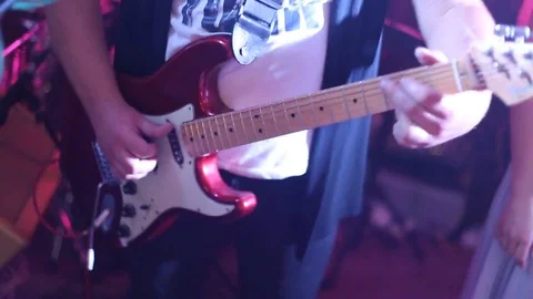Mans hands playing electro guitar on wedding party. Stock Footage 107882308