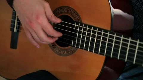 Man's hands playing guitar . Stock Footage 57859213