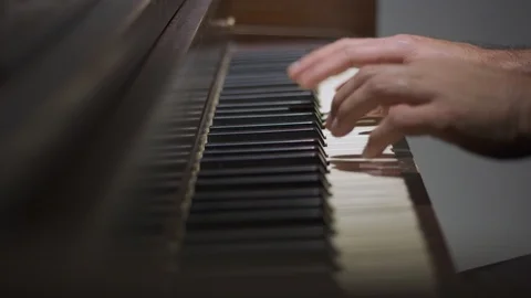 Man's hands playing the piano Stock Footage 122184083