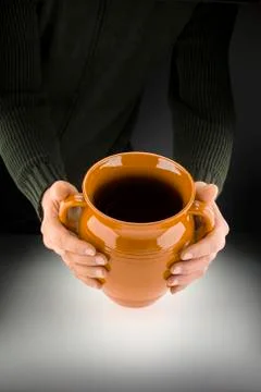 Man's hands with pot Stock Photos
