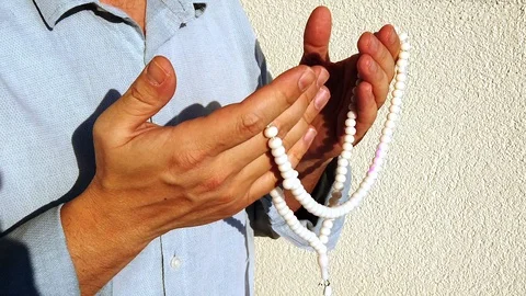 Man's hands. Prayer. Beads. Close-up. Stock Footage 129845980