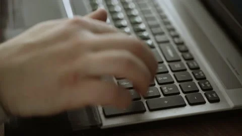 Man's hands press the keys on numpad of laptop Stock Footage 149833702