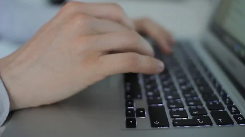 Man's hands print on the laptop Stock Footage