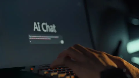 A mans hands rapidly enter a query into an AI-driven chat window on a comput Stock Footage 331473933