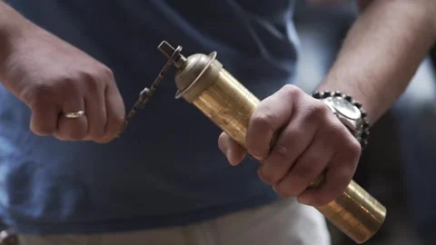 Man's hands rotate a hand coffee grinder Video stock 255049017