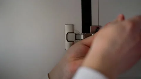 Man's hands screwing a screw using screwdriver. Blank space for text or logo Stock Footage 153292405