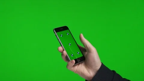 Man's hands scrolling pages using phone with green screen Stock Footage 105597375