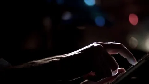 Man's hands scrolling tablet night pan Stock Footage 69272357