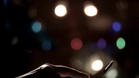 Man's hands scrolling tablet night tilt down Stock Footage 69272845