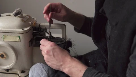 Man's hands sewing leather on furrier machine Stock Footage 101368973
