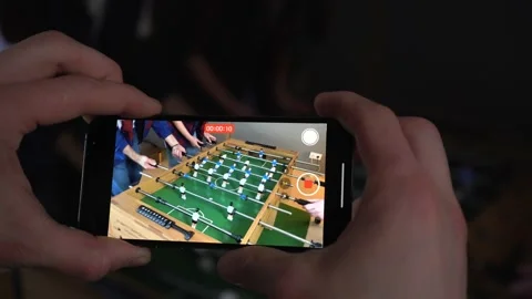 Mans Hands Shooting The Game on His Phone Stock Footage 150290884