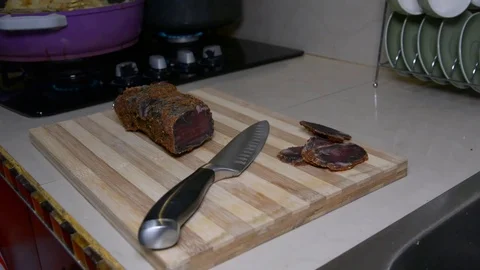 Mans hands sliced dried beaf 스톡 동영상 83154919