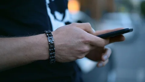 Man's hands with smartphone chatting Stock Footage 94354439