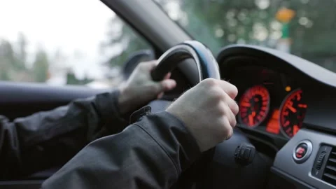 Man's hands steering wheel driving, car interior, driving, commuter, daily Stock Footage 230178135