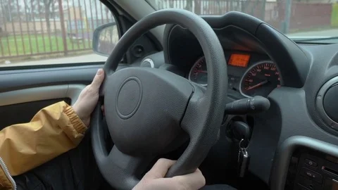 Man's hands on a steering wheel Stock Footage 75040589