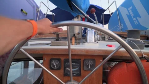 Man's hands on the steering wheel of a sailing yacht Stock Footage 280006281
