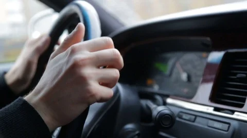 Man's hands on the steering wheel while riding Vídeo Stock 82502741