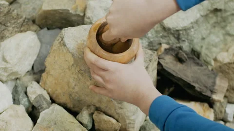 Man's hands with stone mortar and pestle close-up. Media. Traditional oriental Stock-Footage 226965297