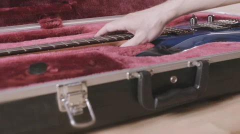 Man's hands take beautiful blue electric guitar out of a case. Ibanez JS1000 Stock Footage 64622119