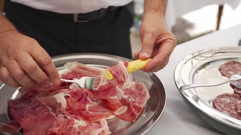 Man's hands take a slice of raw ham. Stock Footage 276606585