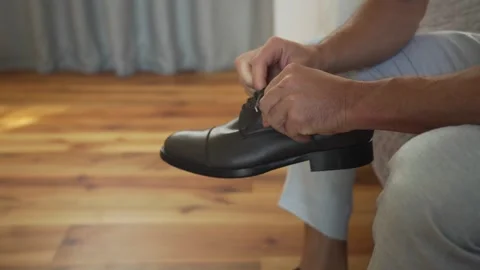 Man's hands ties a shoe. Stock Footage 276606513