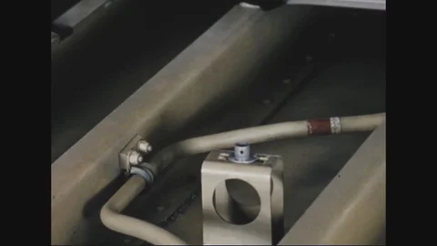 A man's hands tightens a fitting inside the fuel cell cavity of a B-52 - 1957 Stock Footage 101160724