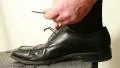 Man's hands tying shoes HD Footage
