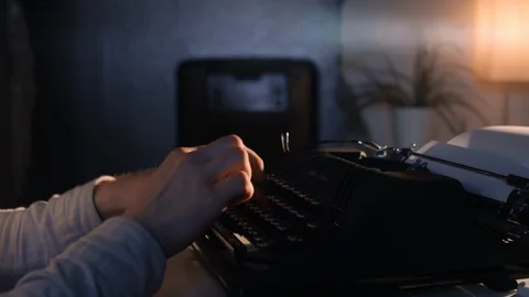 Man's hands type on an old vintage typewriter Stock Footage 97763892