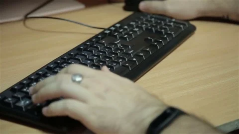 Man's hands typing on desktop keyboard Stock Footage 81039822