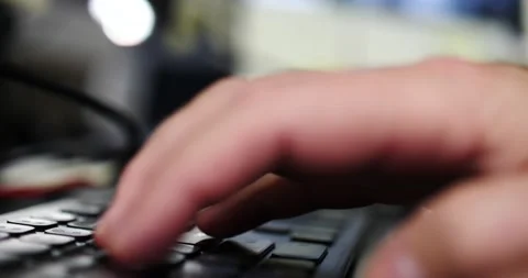 Man's hands typing on keyboard computer side view movement Stock Footage 206283134