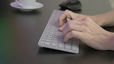 Man's hands typing on keyboard Stock Footage 81564124