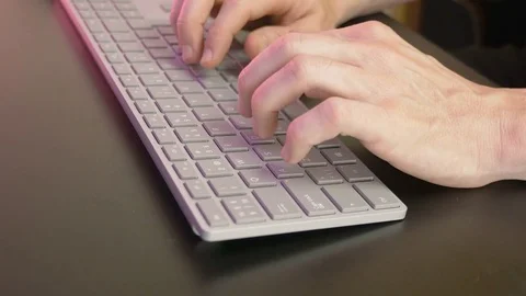 Man's hands typing on keyboard Stock Footage 81564282