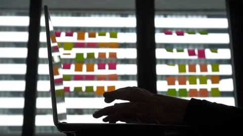 Mans Hands Typing on a Laptop on background of Window Lit Office Stock Footage 238526020