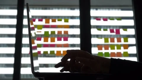 Mans Hands Typing on a Laptop on background of Window Lit Office Stock Footage 238526113