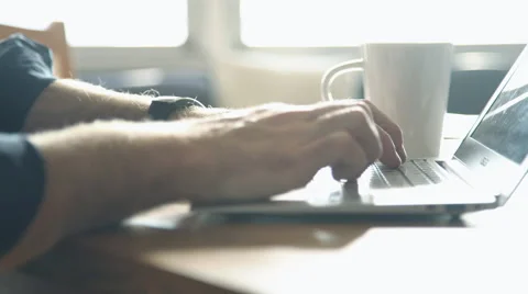 Man's hands typing on laptop computer keyboard Stock Footage 63283426