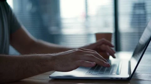 Man's hands typing on a laptop keyboard. Stock Footage 154449853