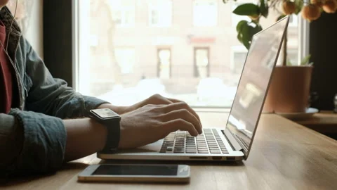 Man's hands typing on laptop keyboard Stock Footage 164947882