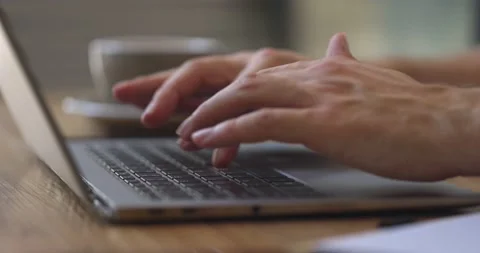 Man's hands typing on laptop.Guy sitting in cafe working online using portable Video stock 160920214