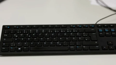 Man's hands typing on QWERTZ computer keyboard Stock Footage 122052433