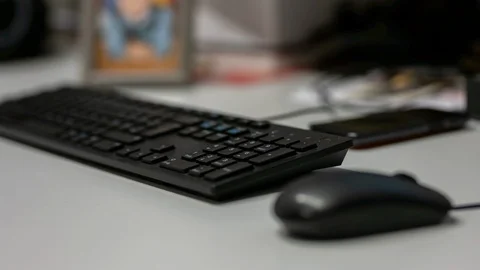 Man's hands typing on QWERTZ computer keyboard and mouse Stock Footage 122053232