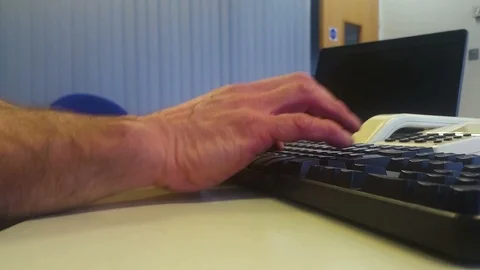 Mans hands typing in a retro looking office Stock Footage 96434944