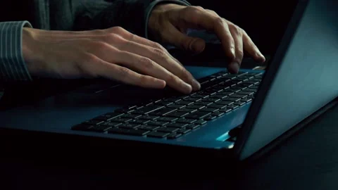Man's hands typing text on a laptop. Late evening. Dark office. Slow motion Stock Footage 102058789