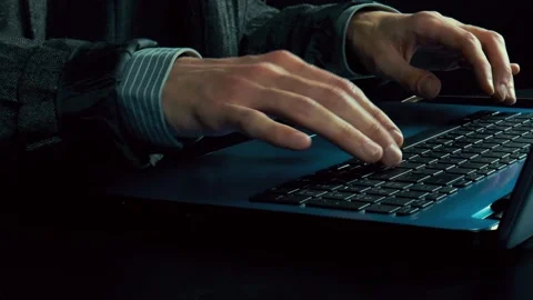 Man's hands typing text on a laptop. Camera moves from left to right Stock Footage 102062307