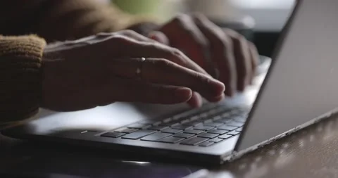 Man's hands typing text on laptop keyboard. Guy using online technology for his Stock Footage 166415164