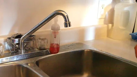Man's hands washing in kitchen Stock Footage 94592774
