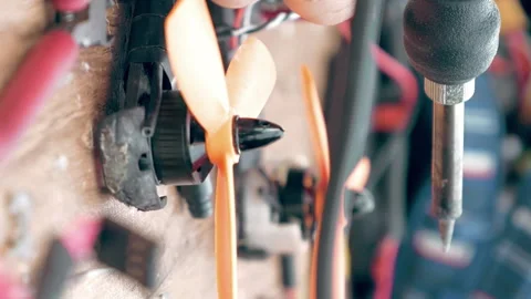Man's hands welding details assembling FPV drone Stock Footage 91143831