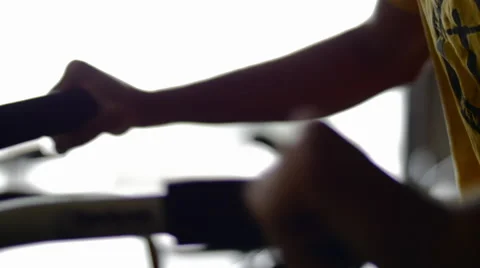 Man's hands while on Exercise bike Stock Footage 42233535