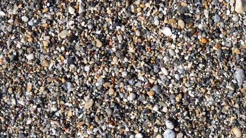 Man's hands will lay out the word love from sea stones with letters Stock Footage 134852118