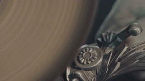 Man's hands working with bench grinder, instruments and iron, shavings on table Stock Footage 152397115