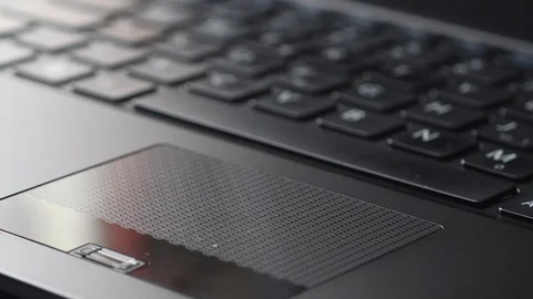 Man's hands working on laptop touchpad Stock Footage 101949919